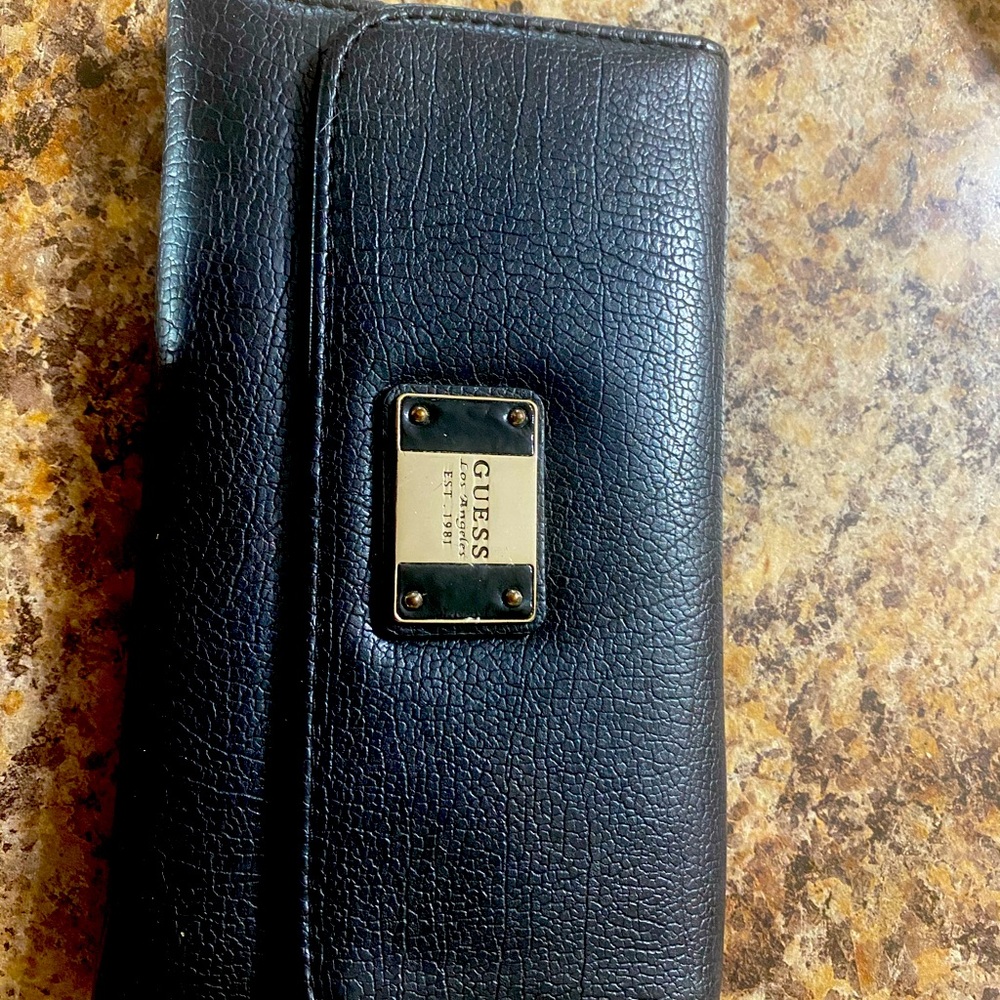 Woman’s wallet!!! One metal mulisha and one quess!